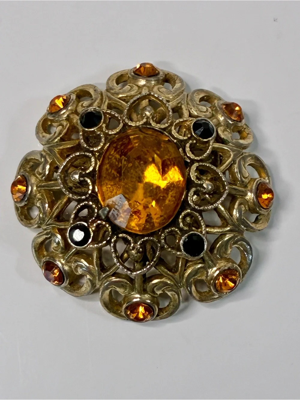 Coro Gold-Tone Heart Shaped Ornate Filigree Brooch with Amber and Black Stones